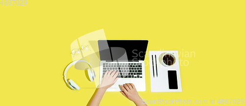 Image of Hand using gadgets, device on top view, blank screen with copyspace, minimalistic style, flyer