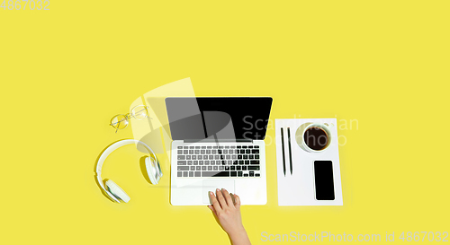 Image of Hand using gadgets, device on top view, blank screen with copyspace, minimalistic style, flyer