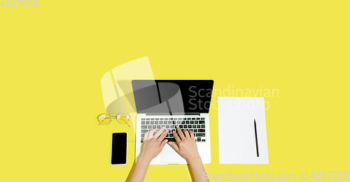 Image of Hand using gadgets, device on top view, blank screen with copyspace, minimalistic style, flyer