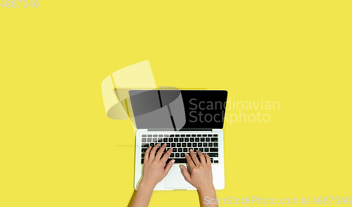 Image of Hand using gadgets, device on top view, blank screen with copyspace, minimalistic style, flyer