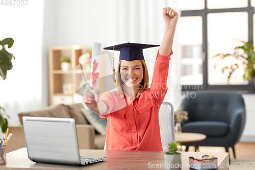 Image of student woman with laptop and diploma at home