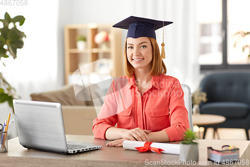 Image of student woman with laptop and diploma at home