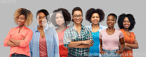 Image of happy african american women over grey background