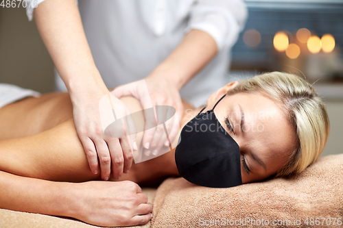 Image of close up of woman lying and having massage in spa