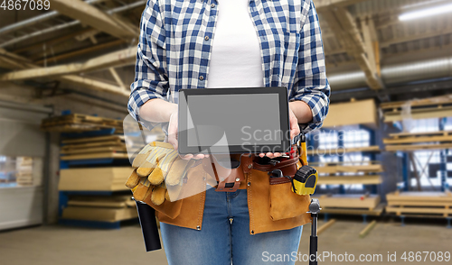 Image of female worker with tools and tablet pc at factory