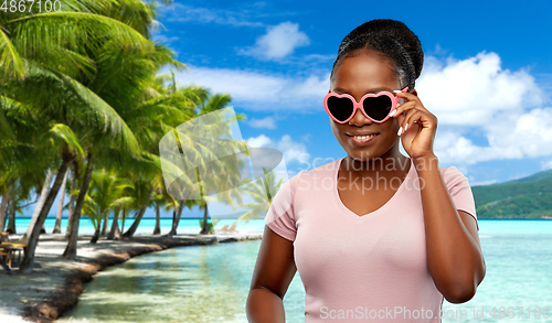 Image of african american woman in heart-shaped sunglasses