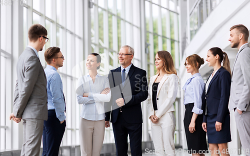 Image of business people talking at office building