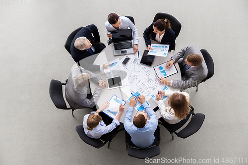 Image of business team with scheme meeting at office