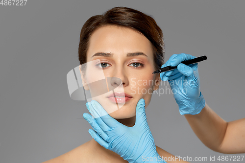 Image of beautiful young woman and hands with marker