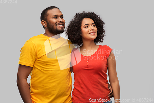 Image of happy african american couple hugging