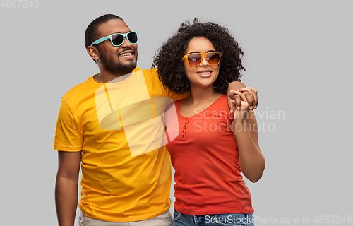 Image of happy african american couple in sunglasses