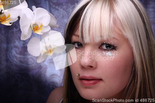 Image of Woman and orchid