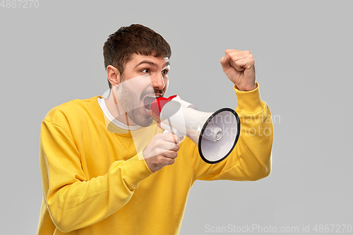 Image of angry man shouting to megaphone