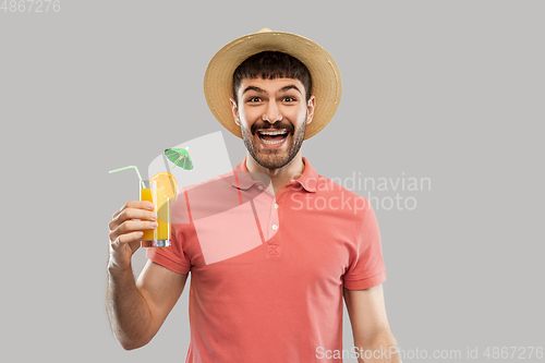 Image of happy man in straw hat with orange juice cocktail