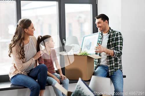 Image of happy family with child moving to new home