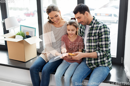 Image of happy family with color palette moving to new home