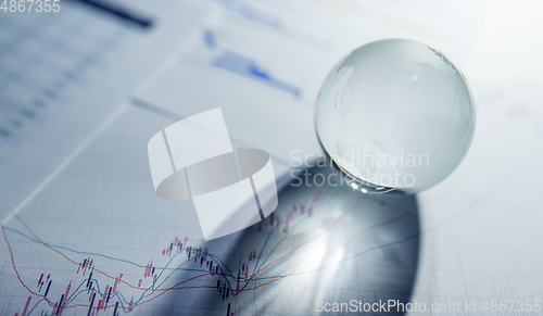 Image of Stock market chart and Glass globe
