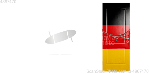 Image of Door colored in Germany flag, locking with chain. Countries lockdown during coronavirus, COVID spreading