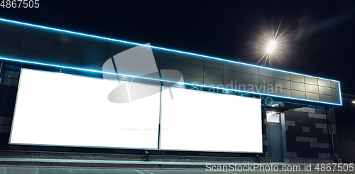 Image of Blank citylight for advertising on the building at city night, copyspace for your text, image, design, flyer