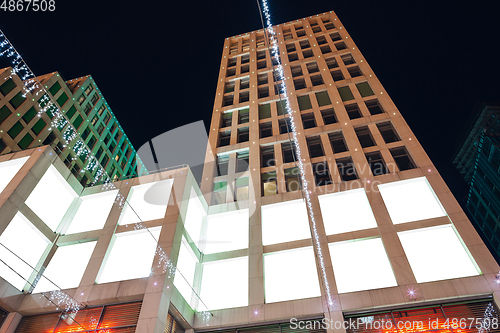 Image of Blank citylight for advertising on the building at city night, copyspace for your text, image, design