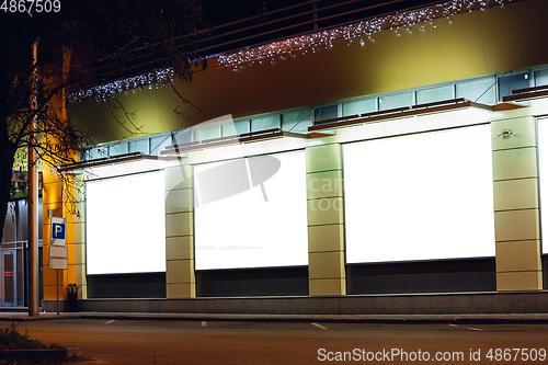 Image of Blank citylight for advertising on the building at city night, copyspace for your text, image, design