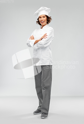 Image of smiling female chef in toque