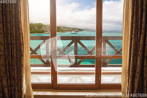 Image of Closed window and beautiful picture outside, nature view, resort and resting