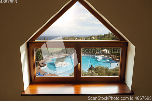 Image of Closed window and beautiful picture outside, nature view, resort and resting