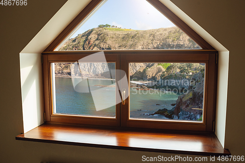 Image of Closed window and beautiful picture outside, nature view, resort and resting