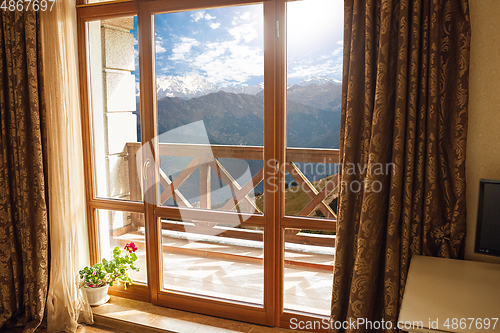 Image of Closed window and beautiful picture outside, nature view, resort and resting