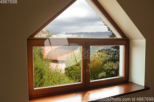 Image of Closed window and beautiful picture outside, nature view, resort and resting