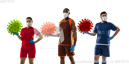 Image of Basketball and football players kicking, punching coronavirus, protection and treatment concept, flyer