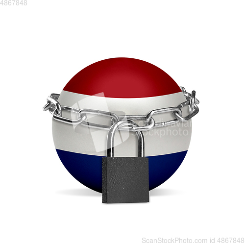 Image of Planet colored in Netherlands flag, locking with chain. Countries lockdown during coronavirus, COVID spreading