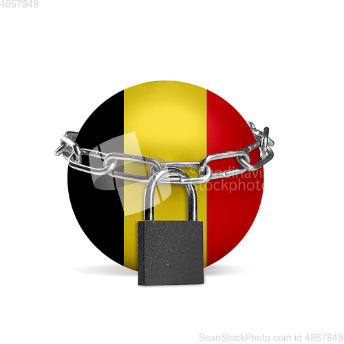 Image of Planet colored in Belgium flag, locking with chain. Countries lockdown during coronavirus, COVID spreading