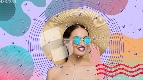 Image of Portrait of a beautiful young woman with bright colorful painted design