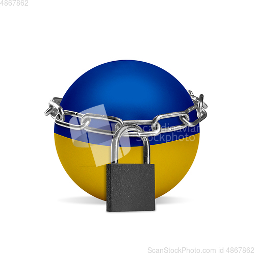 Image of Planet colored in Ukraine flag, locking with chain. Countries lockdown during coronavirus, COVID spreading