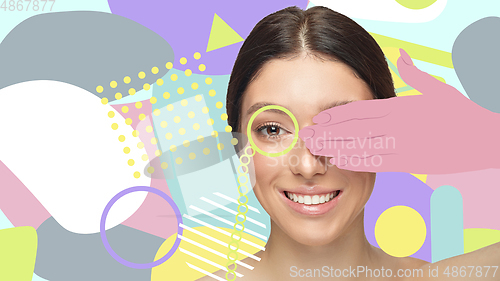 Image of Portrait of a beautiful young woman with bright colorful painted design