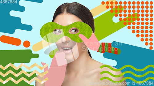Image of Portrait of a beautiful young woman with bright colorful painted design