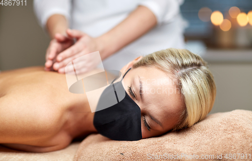 Image of close up of woman lying and having massage in spa