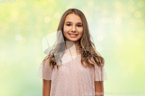 Image of smiling young teenage girl in party dress