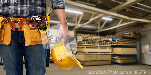 Image of male worker with helmet and working tools