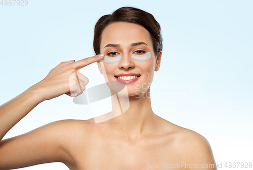 Image of beautiful young woman with under-eye patches
