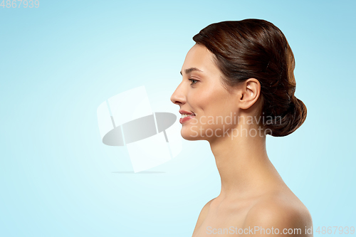 Image of profile of beautiful woman with bare shoulders