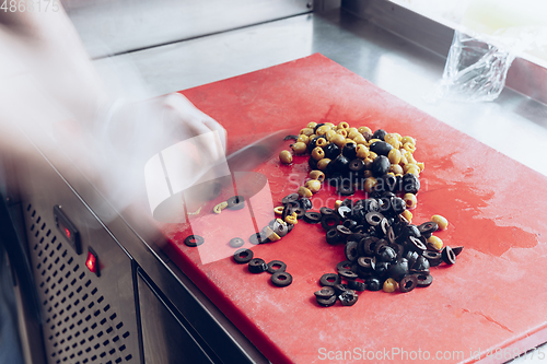 Image of Behind the scenes of brands. The chef cooking in a professional kitchen of a restaurant meal for client or delivery. Motion.