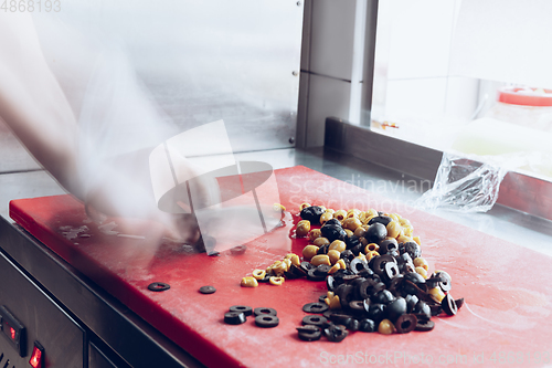 Image of Behind the scenes of brands. The chef cooking in a professional kitchen of a restaurant meal for client or delivery. Motion.