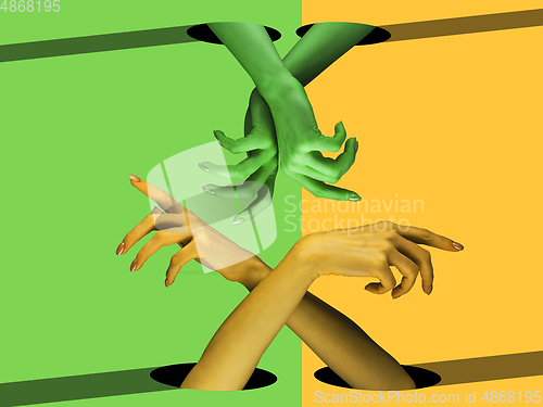 Image of Bright painted hands touching by fingers. Contemporary art collage.