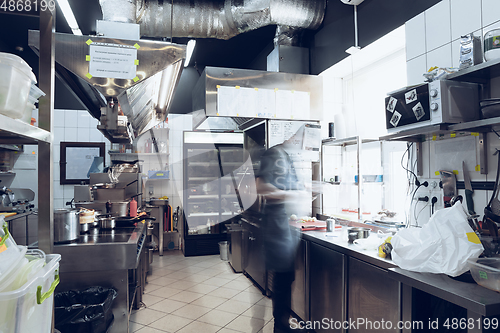 Image of Behind the scenes of brands. The chef cooking in a professional kitchen of a restaurant meal for client or delivery. Motion.