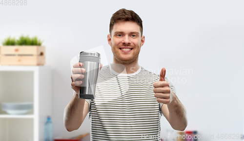 Image of man with thermo cup or tumbler for hot drinks