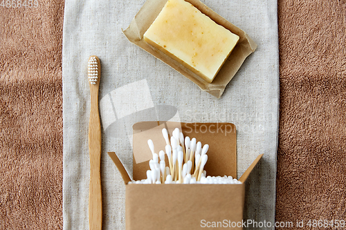 Image of wooden toothbrush, handmade soap cotton swabs