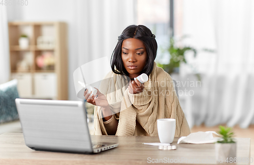 Image of sick woman having video call on laptop at home